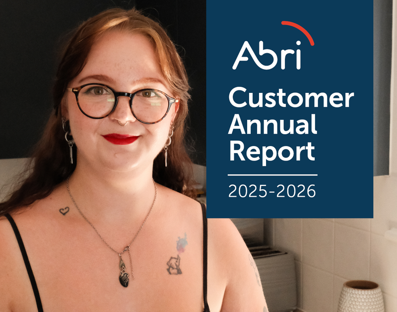 Abri Customer Annual Report 2025-2026 front cover featuring a woman with brown hair and red lipstick, smiling.