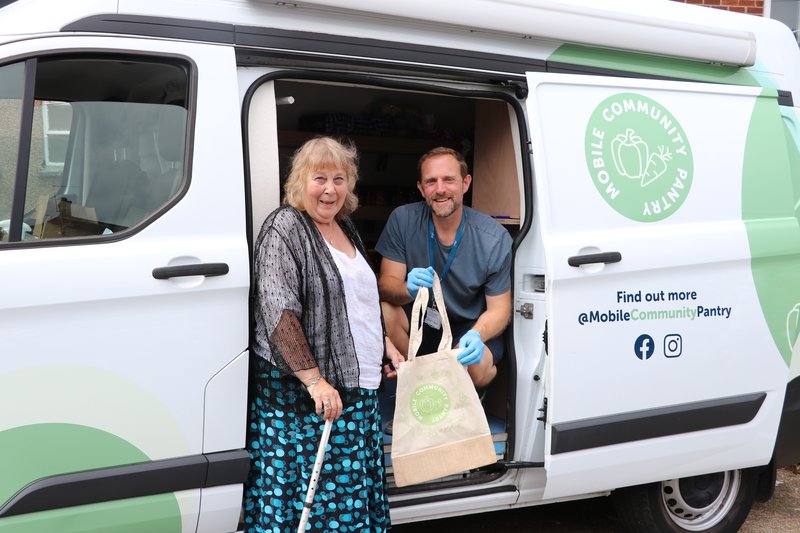 Bobby Tait with mobile community pantry customer